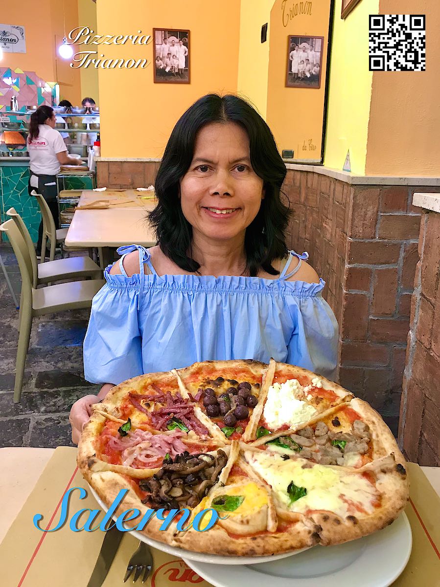 Italy Salerno woman holding a big pizza at Pizzeria Trianon