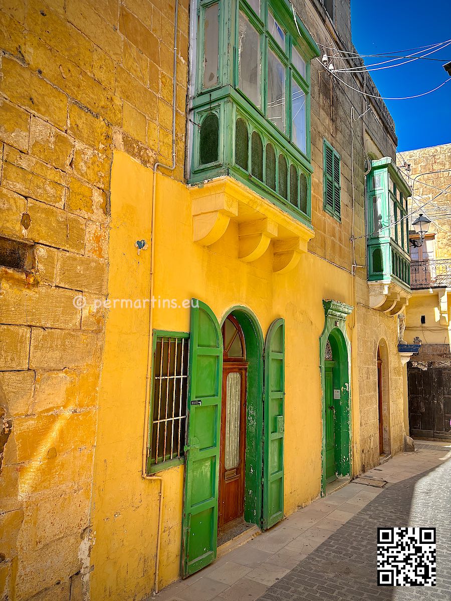 Malta Gozo Victoria street green doors yellow house