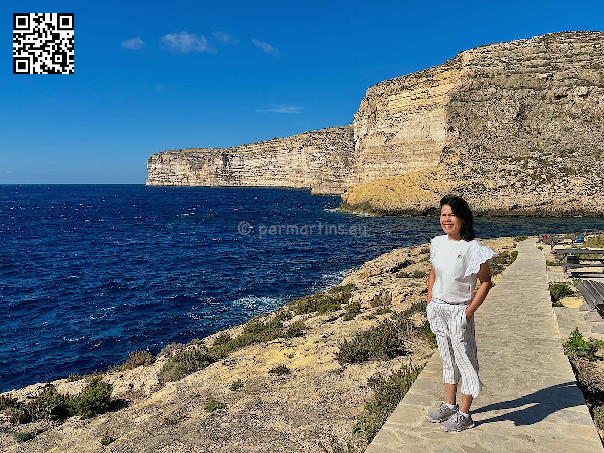 Malta Gozo Xlendi woman at Kantra Valley windy