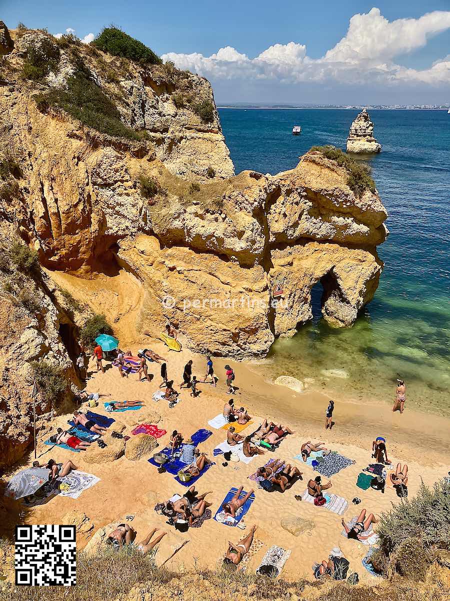 Portugal Algarve Lagos view over Praia do Camilo beach people sunbathing
