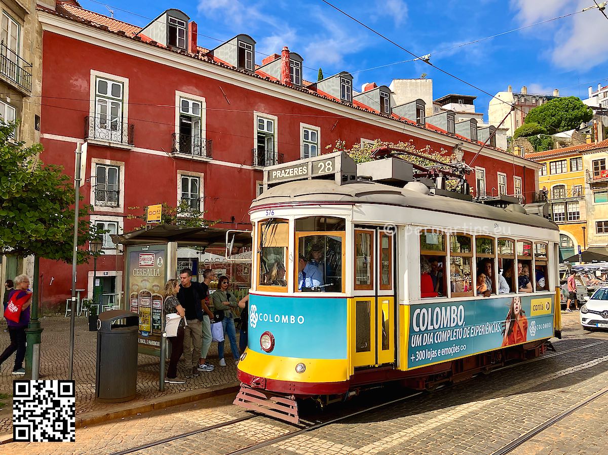 Portugal Lisbon Alfama old tram with tourist red house behind
