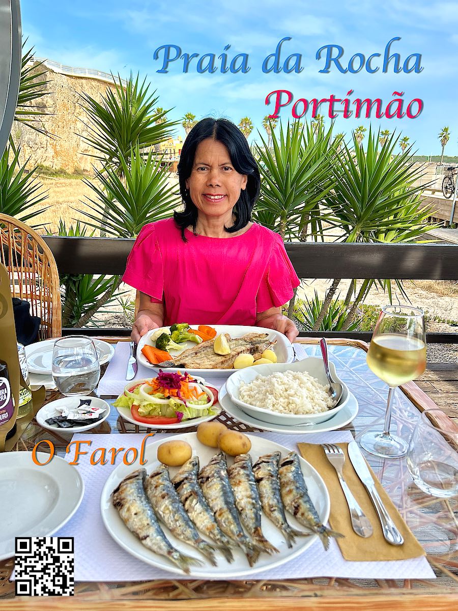 Portugal Portimão Praia da Rocha woman eating fish at O Farol restaurant plus sardines on a plate