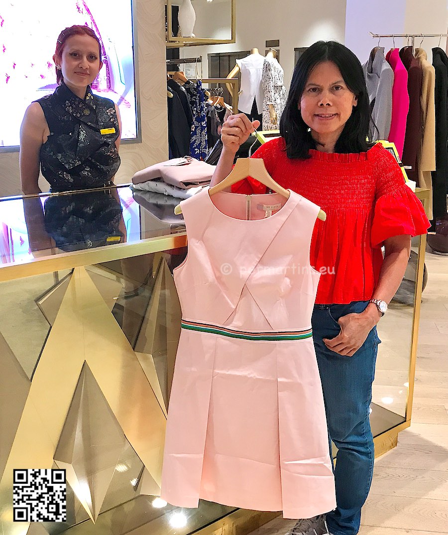 England London Selfridges woman holding a pink dress at Ted Baker shop