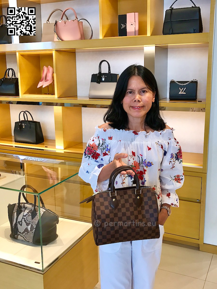 Italy Padova woman holding a Louis Vuitton handbag 