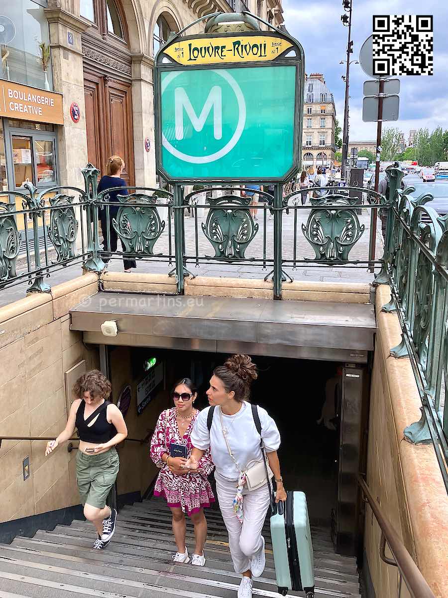 France Paris Metro Louvre-Rivoli three woman walking up stairs